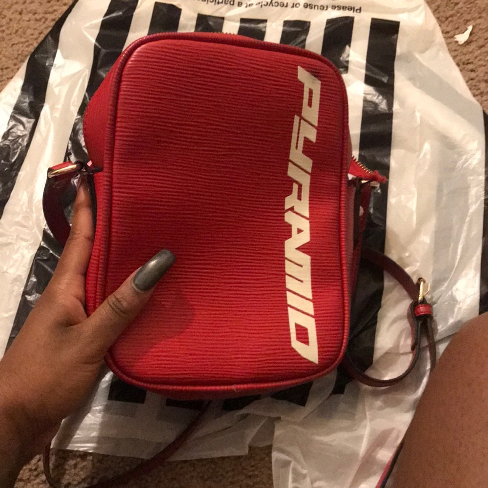 Red pyramid cross body bag